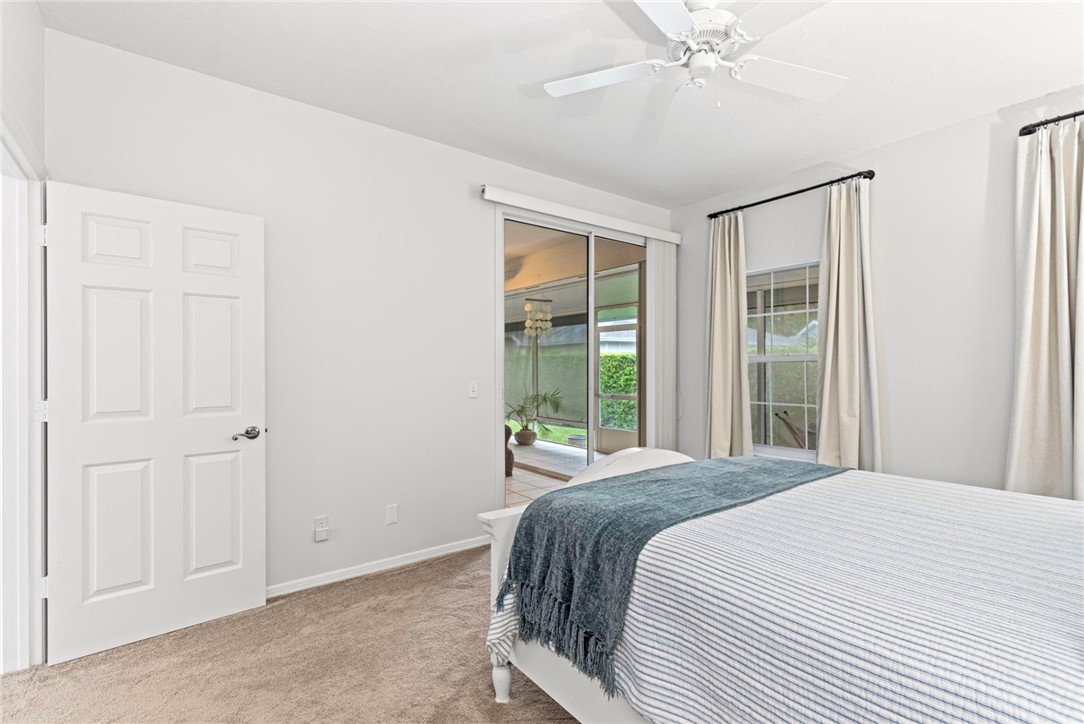750 Timber Ridge Trail Southwest Vero Beach, FL 32962 - Photo 12 of 26 a bedroom with a large bed and a window