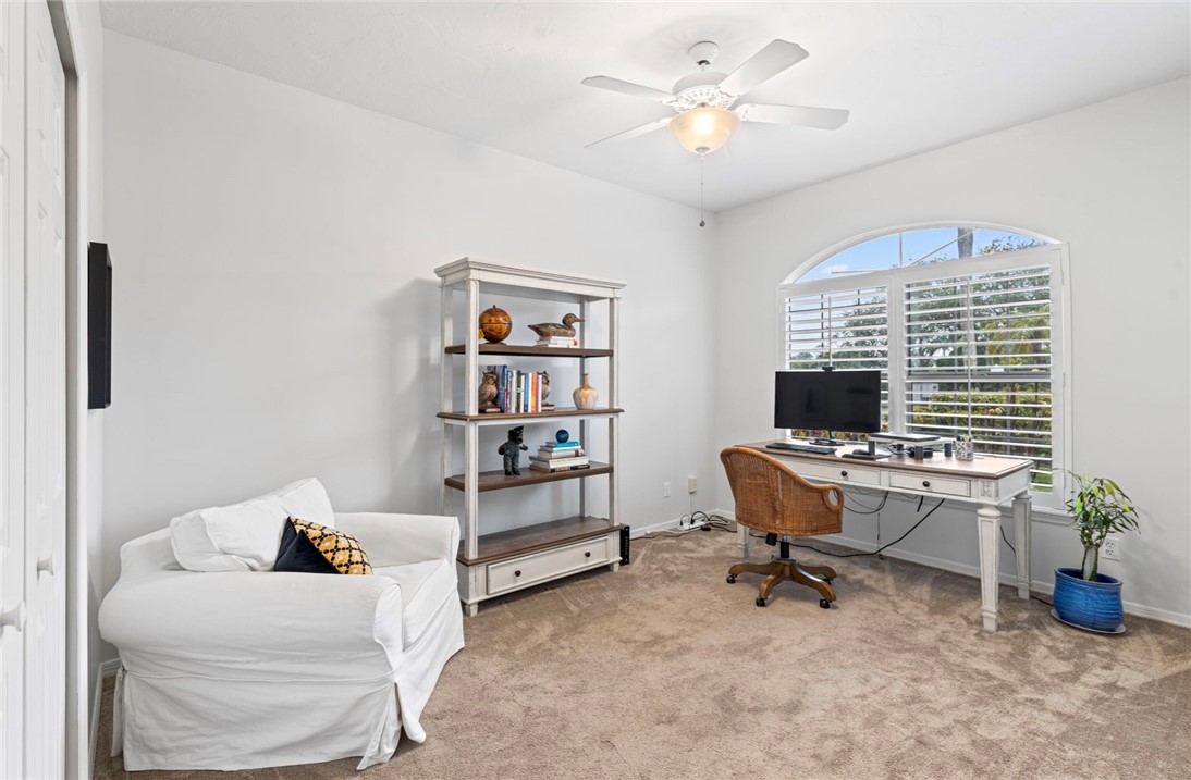 750 Timber Ridge Trail Southwest Vero Beach, FL 32962 - Photo 14 of 26 a view of a workspace with furniture and a window