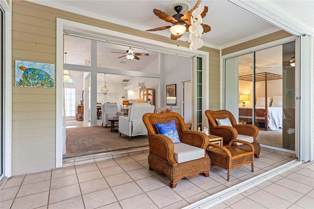 750 Timber Ridge Trail Southwest Vero Beach, FL 32962 - Photo 16 of 26 a living room with furniture and a large window