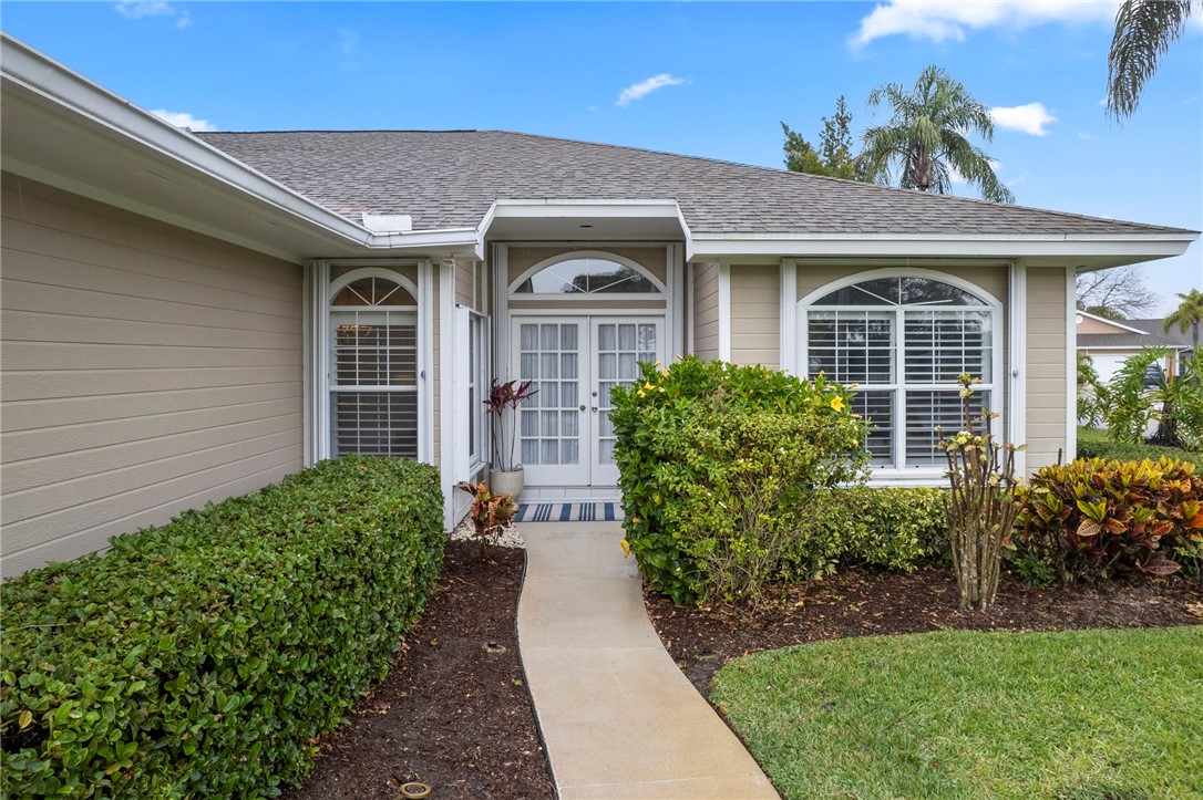 750 Timber Ridge Trail Southwest Vero Beach, FL 32962 - Photo 18 of 26 front view of a house with a yard