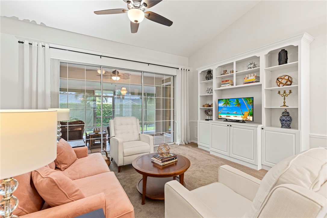 750 Timber Ridge Trail Southwest Vero Beach, FL 32962 - Photo 2 of 26 a living room with furniture and a large window