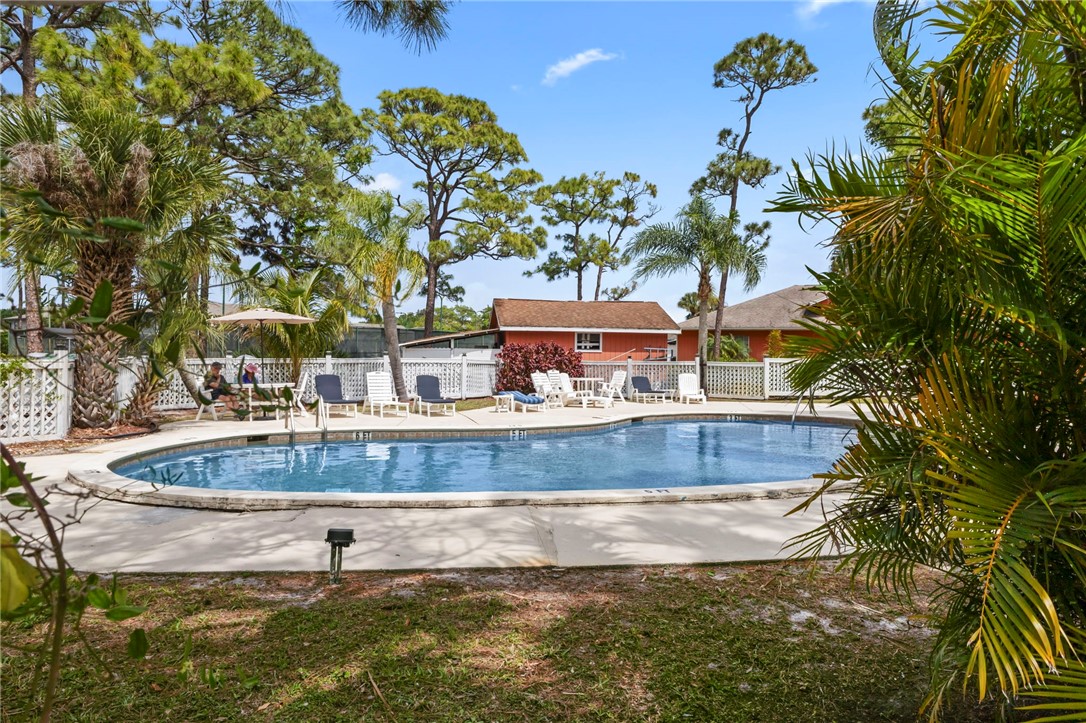 750 Timber Ridge Trail Southwest Vero Beach, FL 32962 - Photo 24 of 26 a view of a house with a yard and sitting area