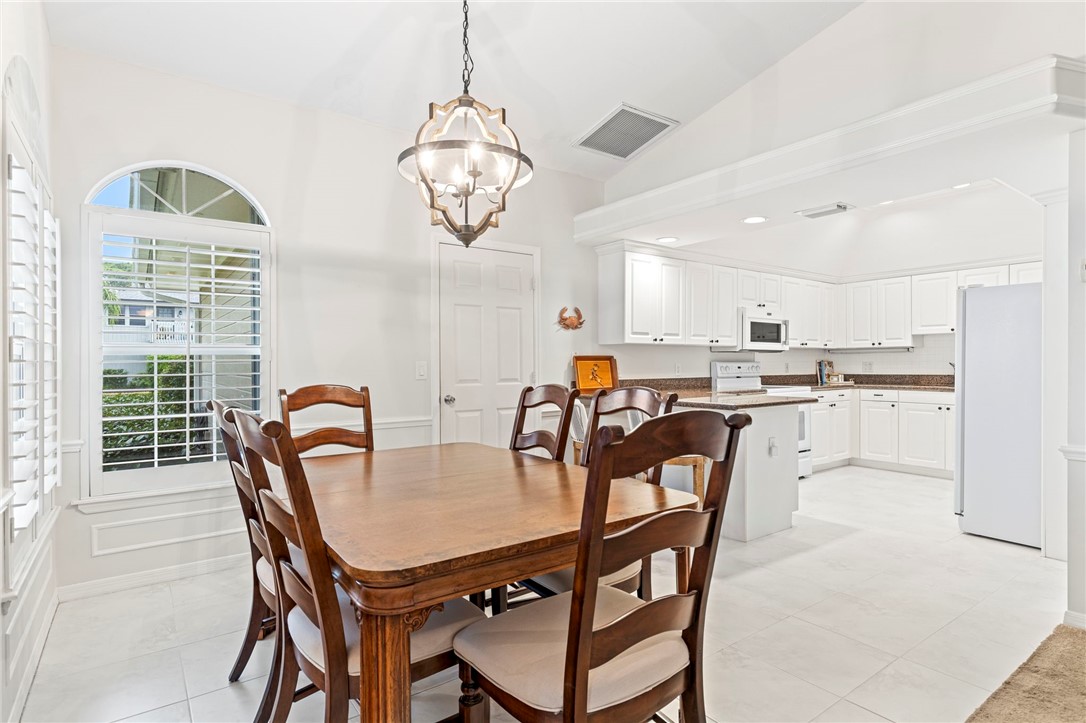 750 Timber Ridge Trail Southwest Vero Beach, FL 32962 - Photo 7 of 26 a view of a dining room with furniture window and outside view