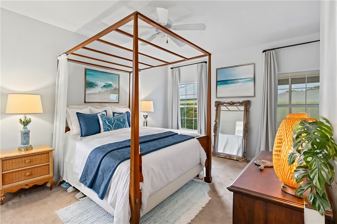 750 Timber Ridge Trail Southwest Vero Beach, FL 32962 - Photo 8 of 26 a bed room with a bed and a window