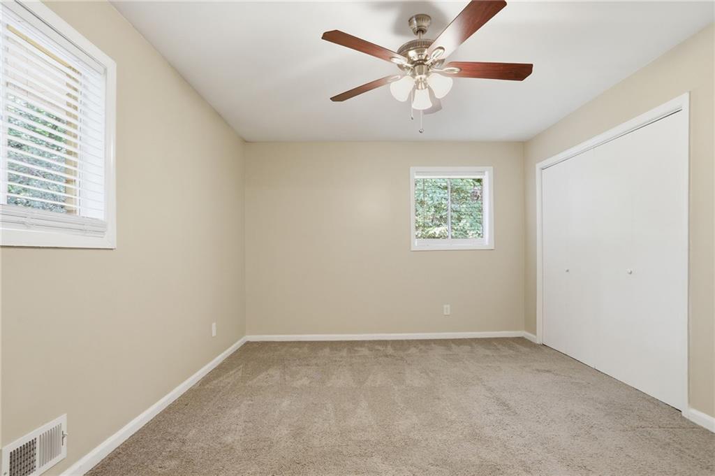 4505 Wonder Valley Trail Decatur, GA 30034 - Photo 17 of 34 an empty room with a window and a fan