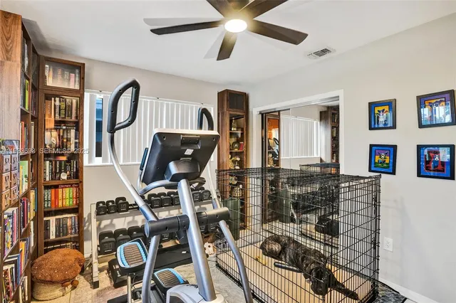 a bathroom with a bathtub shower sink vanity mirror and toilet