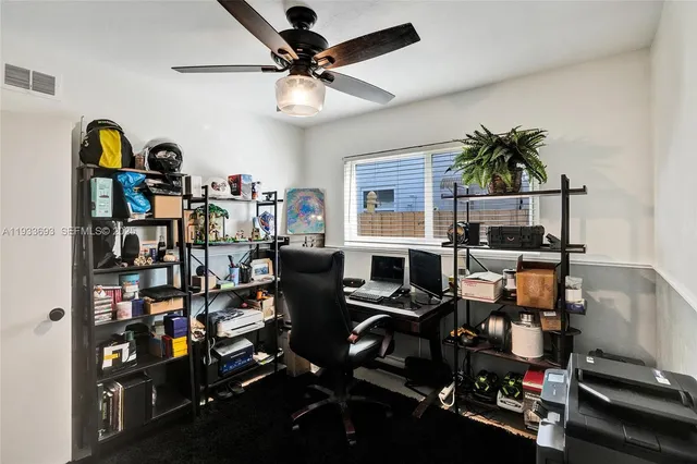 a bed room with a bed and a television