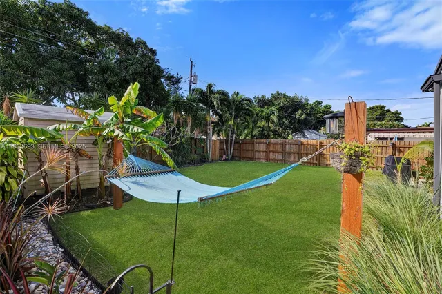 an aerial view of a house with a garden