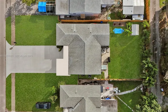 an aerial view of residential houses with city view