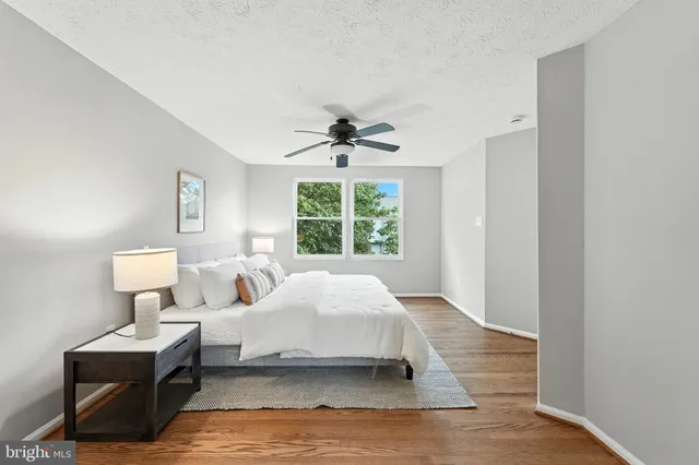 a bed room with a bed and a window