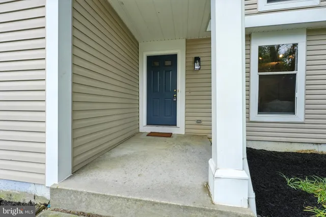 a view of a house with a door and a window