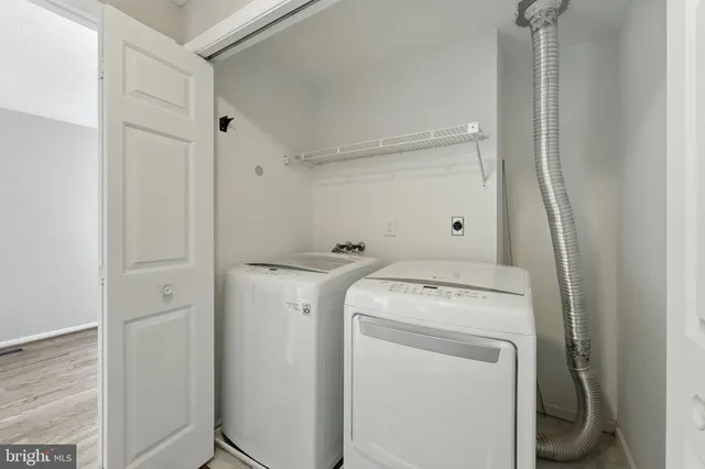 a view of a hallway with a chandelier
