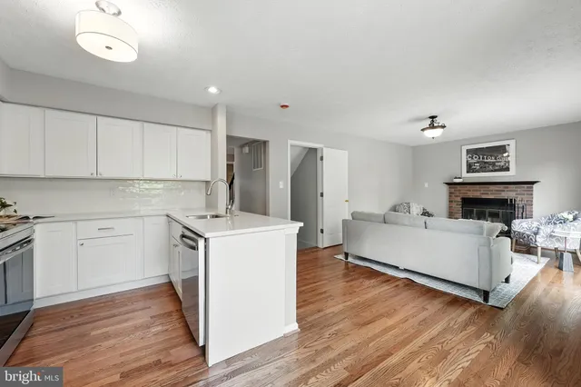 a view of kitchen with furniture and wooden floor