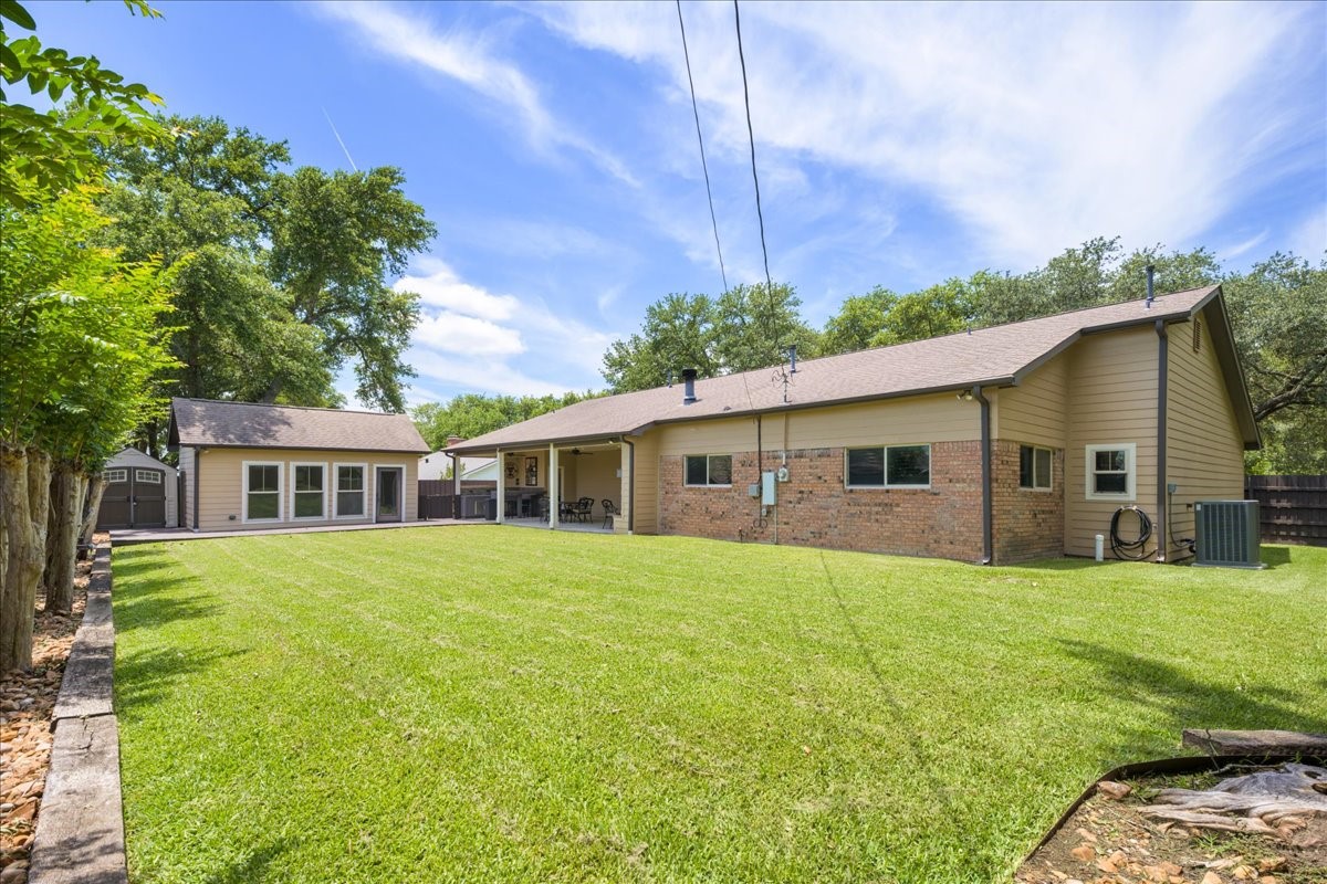 1502 Reimer Street Brenham, TX 77833 - Photo 4 of 30 a front view of a house with a garden