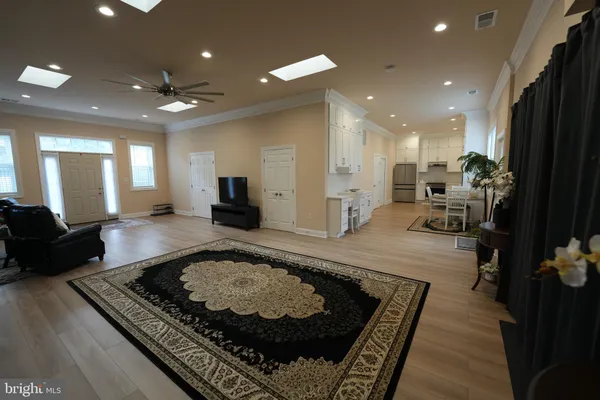 a large kitchen with stainless steel appliances granite countertop a stove and granite counter tops