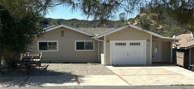 a house with a tree in the background