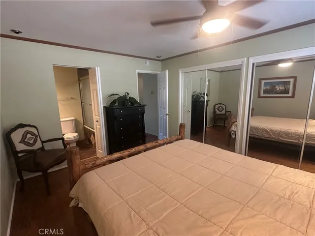 a view of an empty room with window and stairs