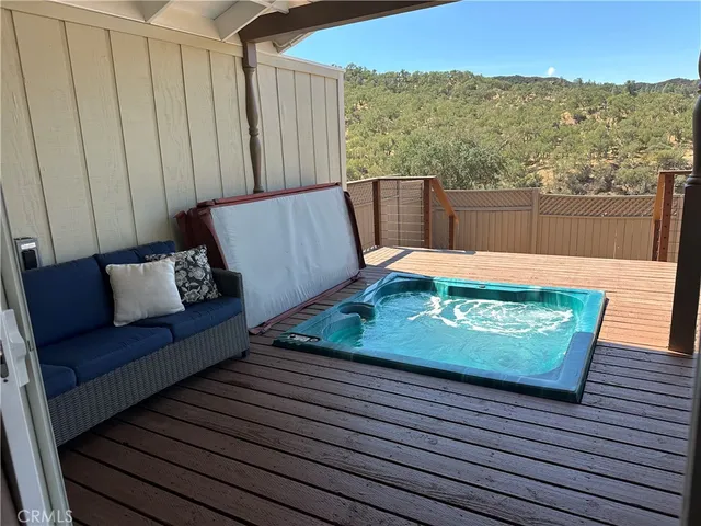 a living room with furniture ceiling fan and a window