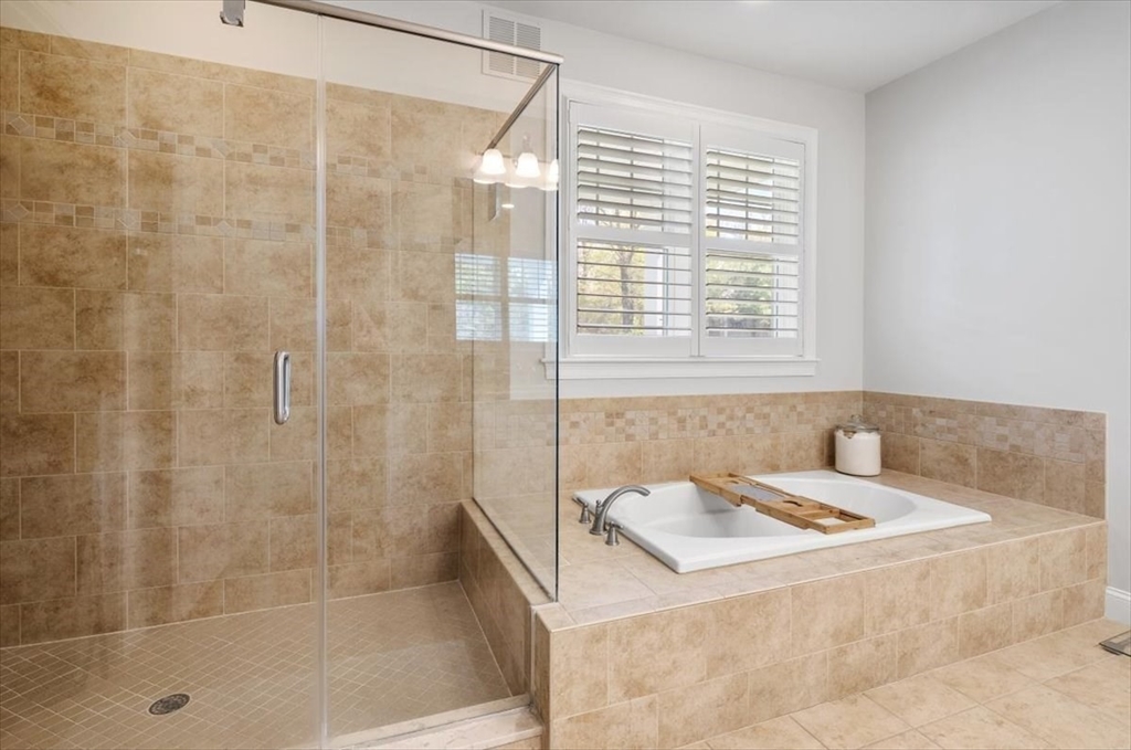 159 Hms Stayner Drive, Unit 159 Hingham, MA 02043 - Photo 12 of 35 a bathroom with a bathtub and a shower