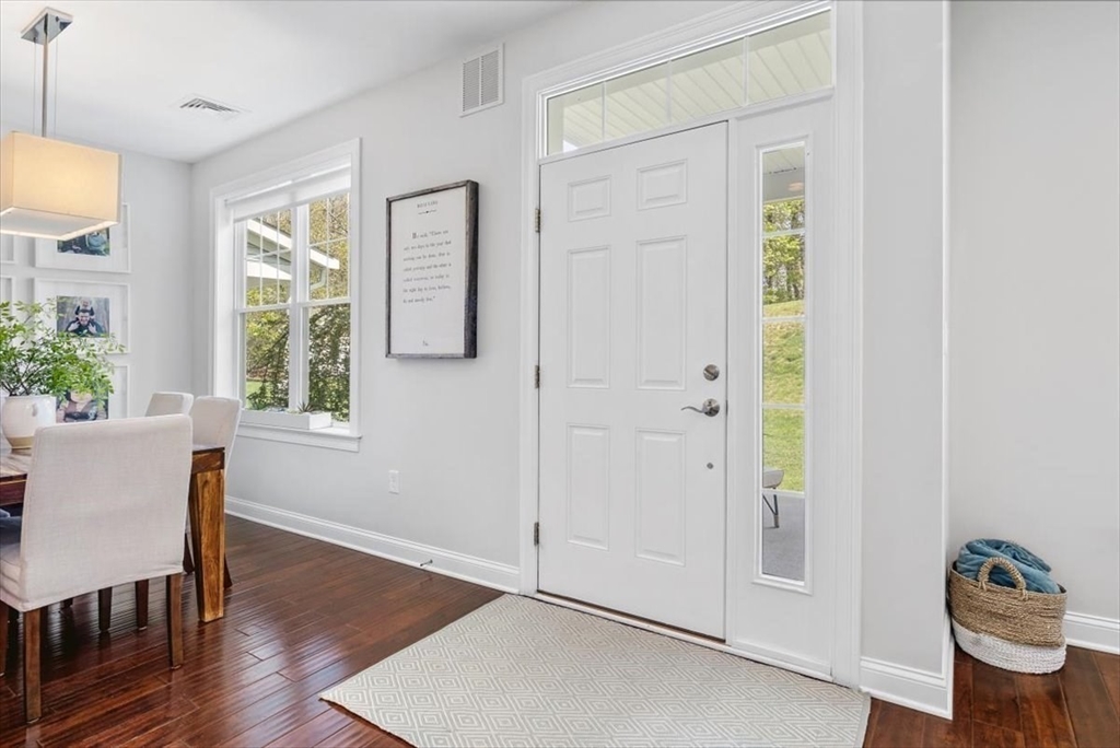 159 Hms Stayner Drive, Unit 159 Hingham, MA 02043 - Photo 20 of 35 a living room with furniture and a window