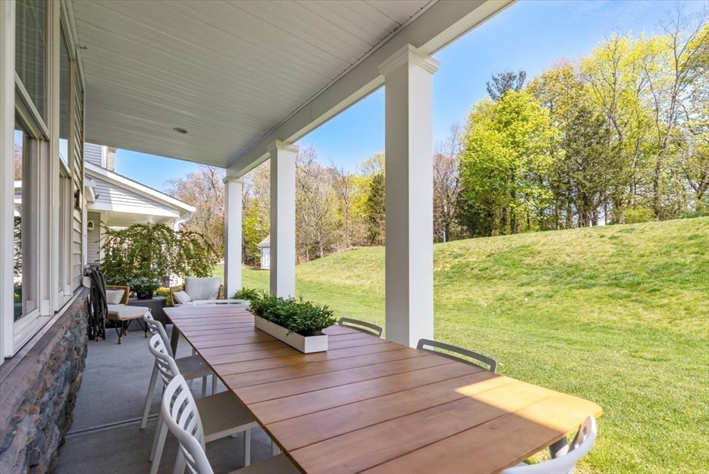 159 Hms Stayner Drive, Unit 159 Hingham, MA 02043 - Photo 21 of 35 a view of a patio with wooden floor