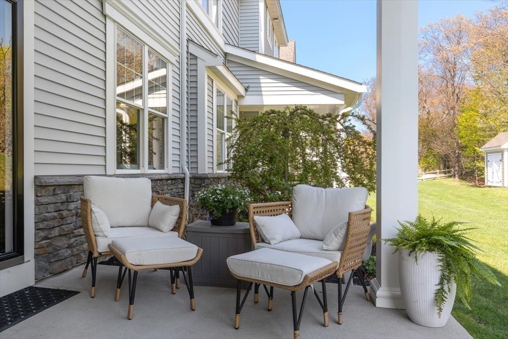 159 Hms Stayner Drive, Unit 159 Hingham, MA 02043 - Photo 23 of 35 a view of a patio with couple of chairs and a potted plant