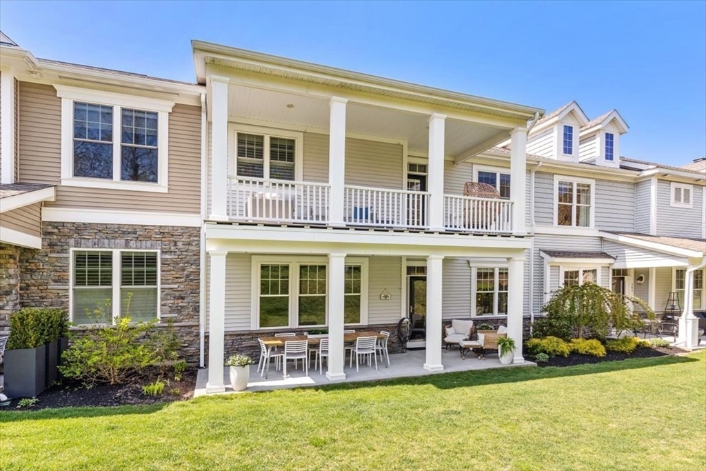 159 Hms Stayner Drive, Unit 159 Hingham, MA 02043 - Photo 24 of 35 a view of a house with a swimming pool and chairs