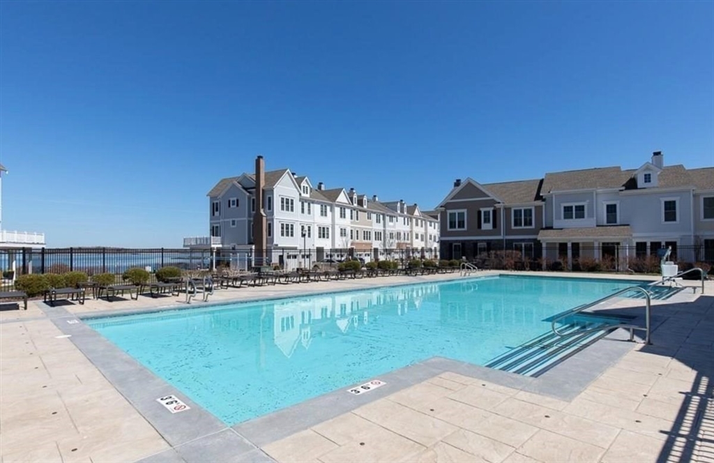 159 Hms Stayner Drive, Unit 159 Hingham, MA 02043 - Photo 28 of 35 a view of a swimming pool next to a building