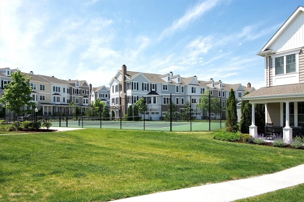 159 Hms Stayner Drive, Unit 159 Hingham, MA 02043 - Photo 29 of 35 a view of a house in a big yard with a big and white house