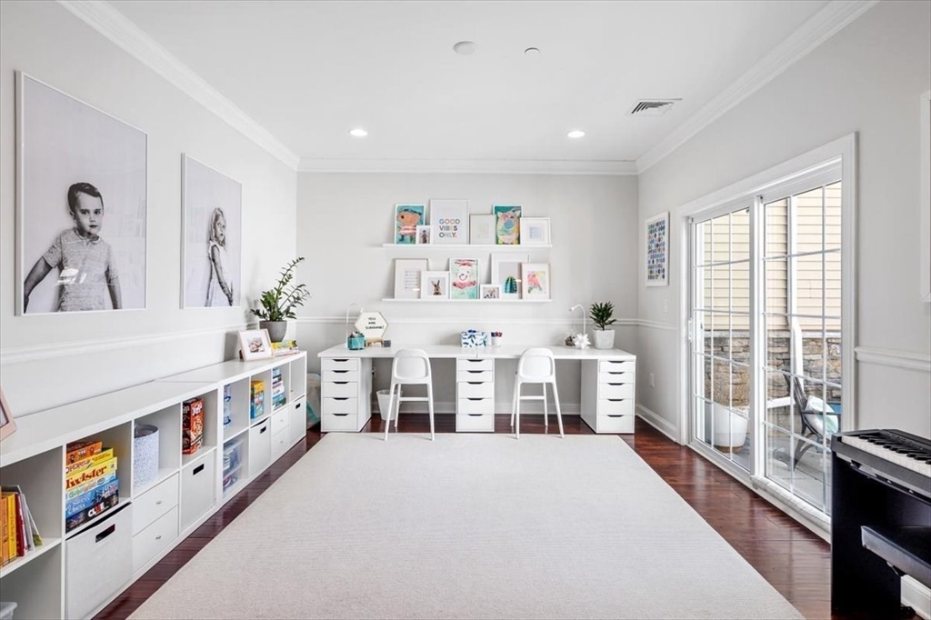 159 Hms Stayner Drive, Unit 159 Hingham, MA 02043 - Photo 8 of 35 a large white room with stainless steel appliances wooden floors and white walls