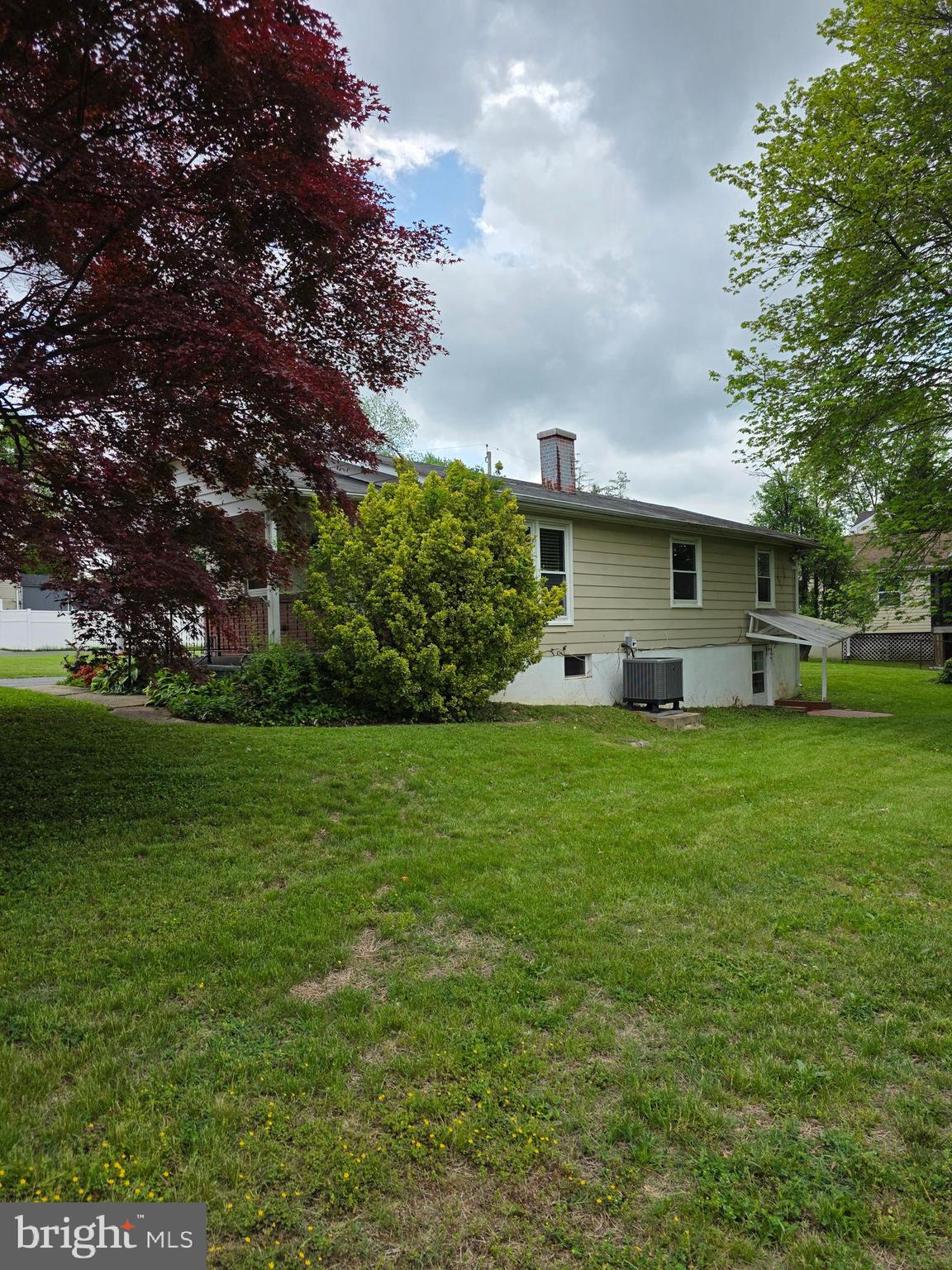 7313 Beech Avenue Baltimore, MD 21206 - Photo 2 of 17 a front view of house with garden
