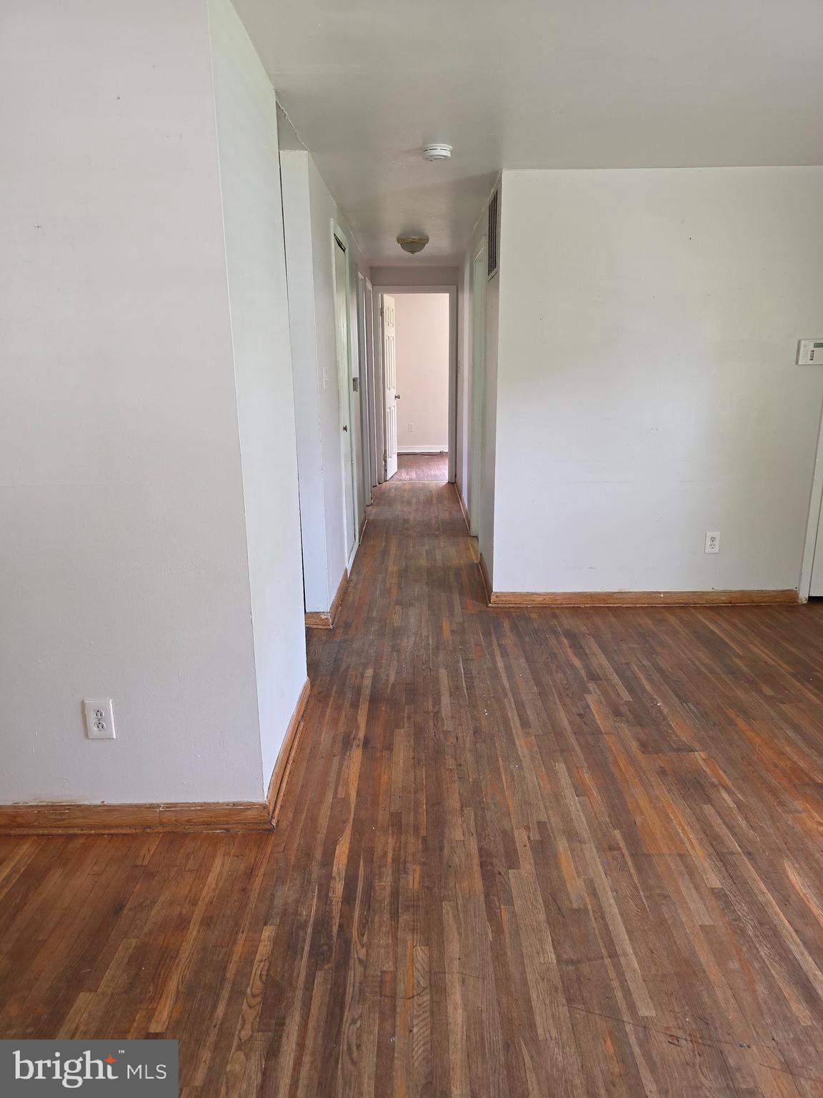 7313 Beech Avenue Baltimore, MD 21206 - Photo 9 of 17 a view of a hallway with wooden floor