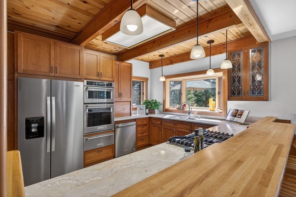 12964 Falcon Point Place Truckee, CA 96161 - Photo 12 of 28 a kitchen with refrigerator and window