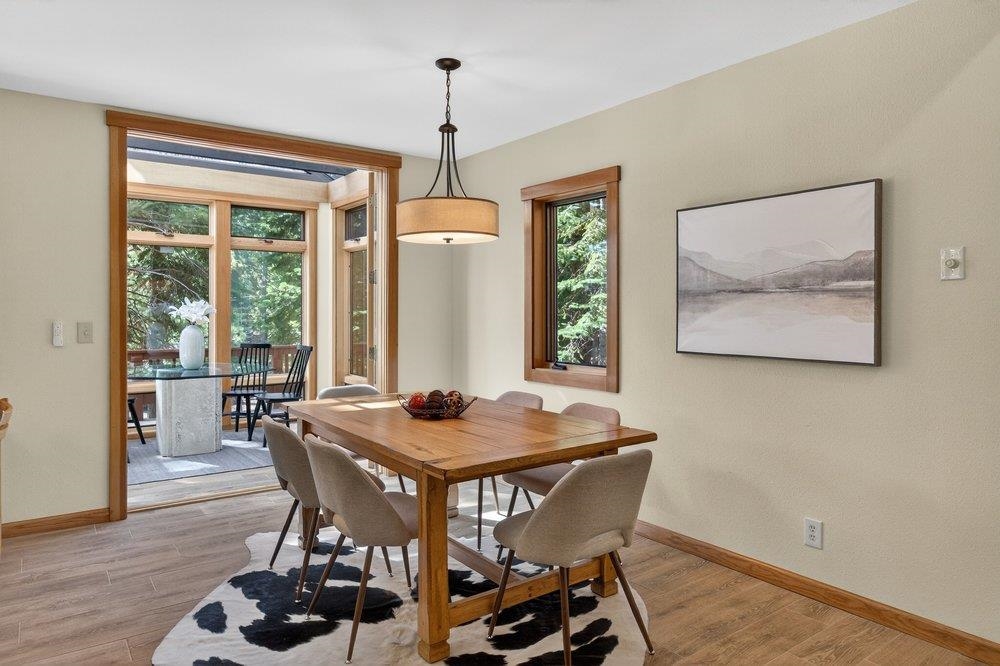 12964 Falcon Point Place Truckee, CA 96161 - Photo 15 of 28 a view of a dining room with furniture window and wooden floor