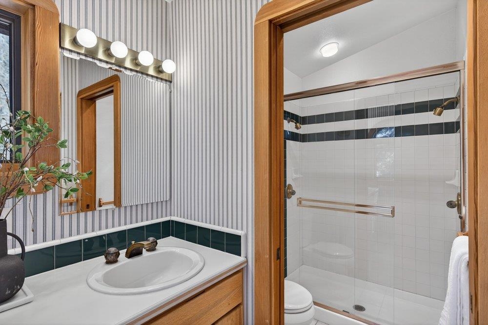 12964 Falcon Point Place Truckee, CA 96161 - Photo 22 of 28 a bathroom with a sink and a mirror