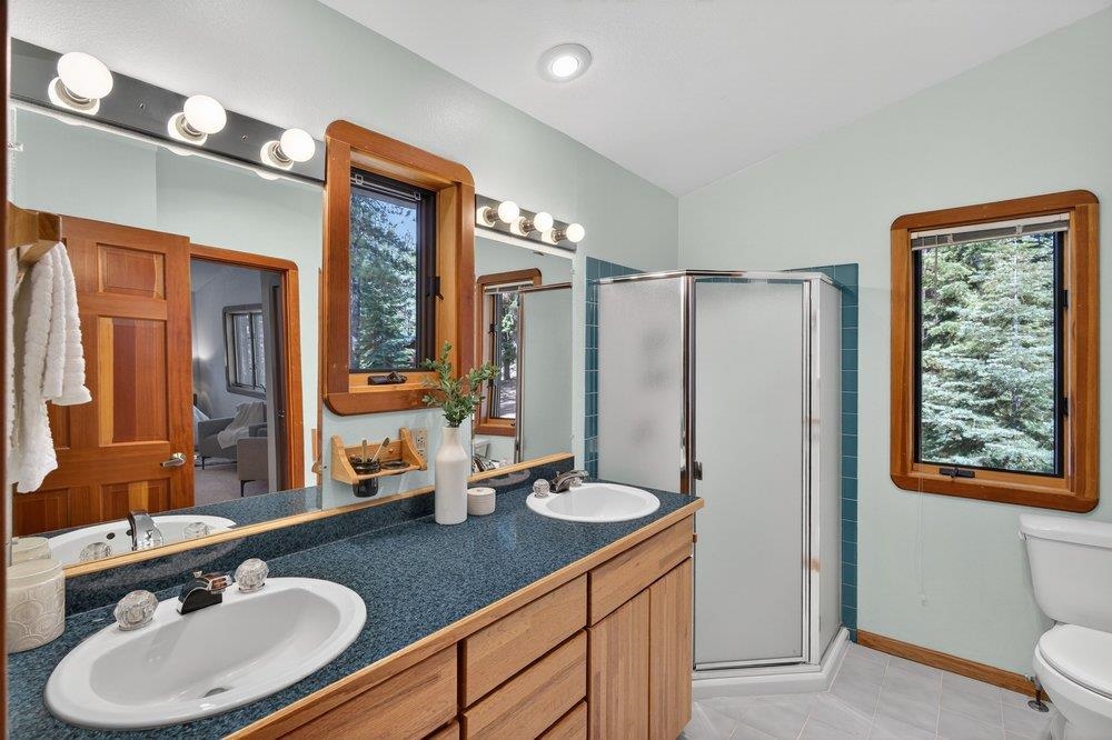 12964 Falcon Point Place Truckee, CA 96161 - Photo 24 of 28 a bathroom with a double vanity sink and a mirror