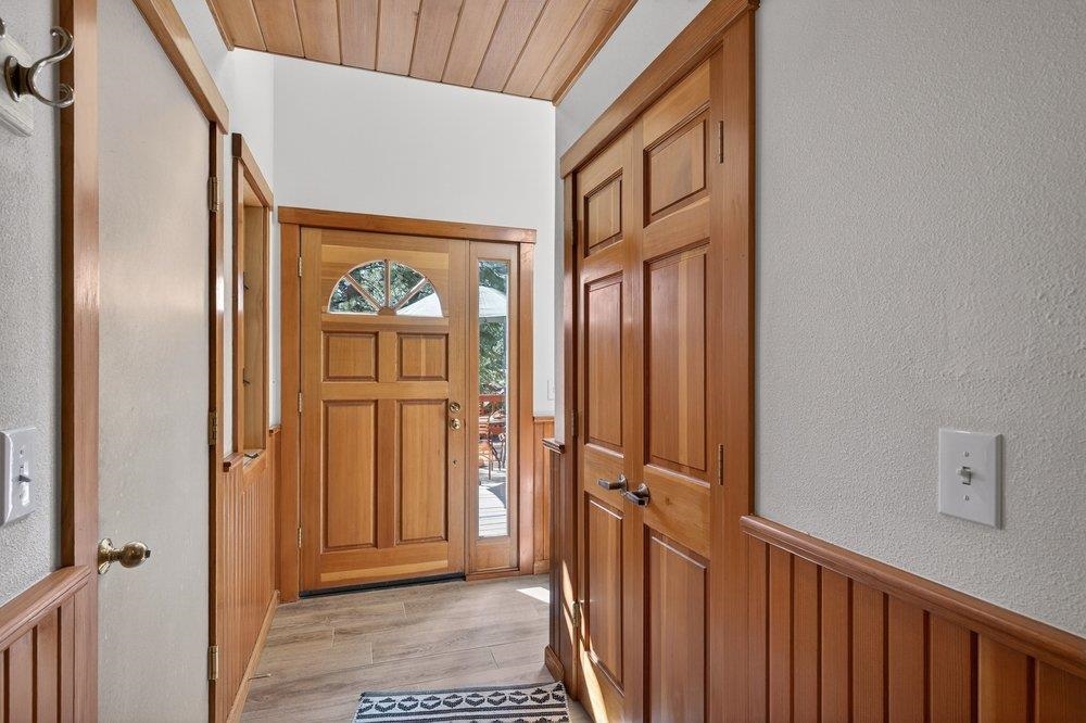 12964 Falcon Point Place Truckee, CA 96161 - Photo 4 of 28 a view of a hallway with wooden floor and entryway