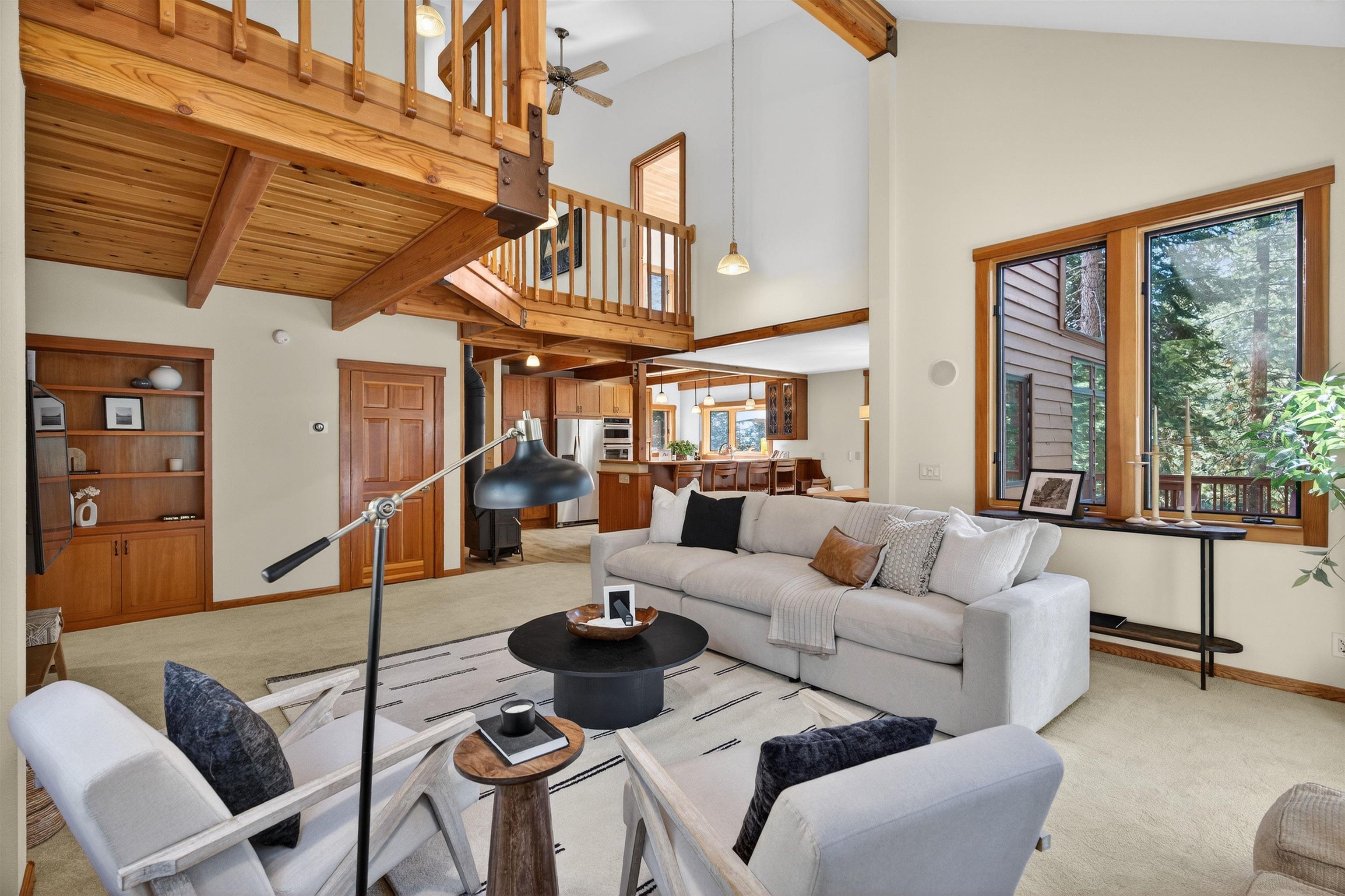 12964 Falcon Point Place Truckee, CA 96161 - Photo 9 of 28 a living room with furniture a ceiling fan and a window
