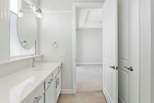 a bathroom with a double vanity sink mirror and