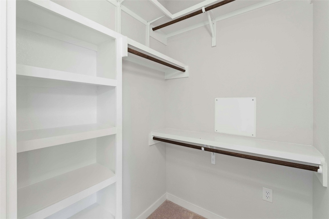 12001 Vista Parke Drive, Unit 702 Austin, TX 78726 - Photo 21 of 33 a view of an empty walk in closet
