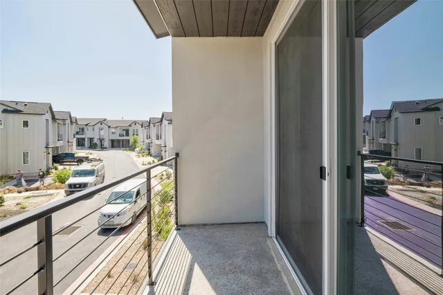 a kitchen view with wooden floor and furniture