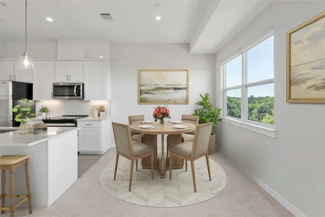 a dining room with kitchen island granite countertop a table chairs a sink dishwasher a dining table and chairs with wooden floor