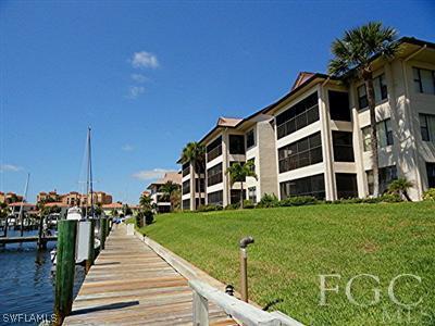 3235 Sugarloaf Key Road, Unit 12A Punta Gorda, FL 33955 - Photo 1 of 8 a view of a building with a yard