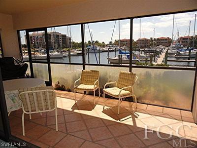 3235 Sugarloaf Key Road, Unit 12A Punta Gorda, FL 33955 - Photo 8 of 8 a balcony with outdoor seating and city view