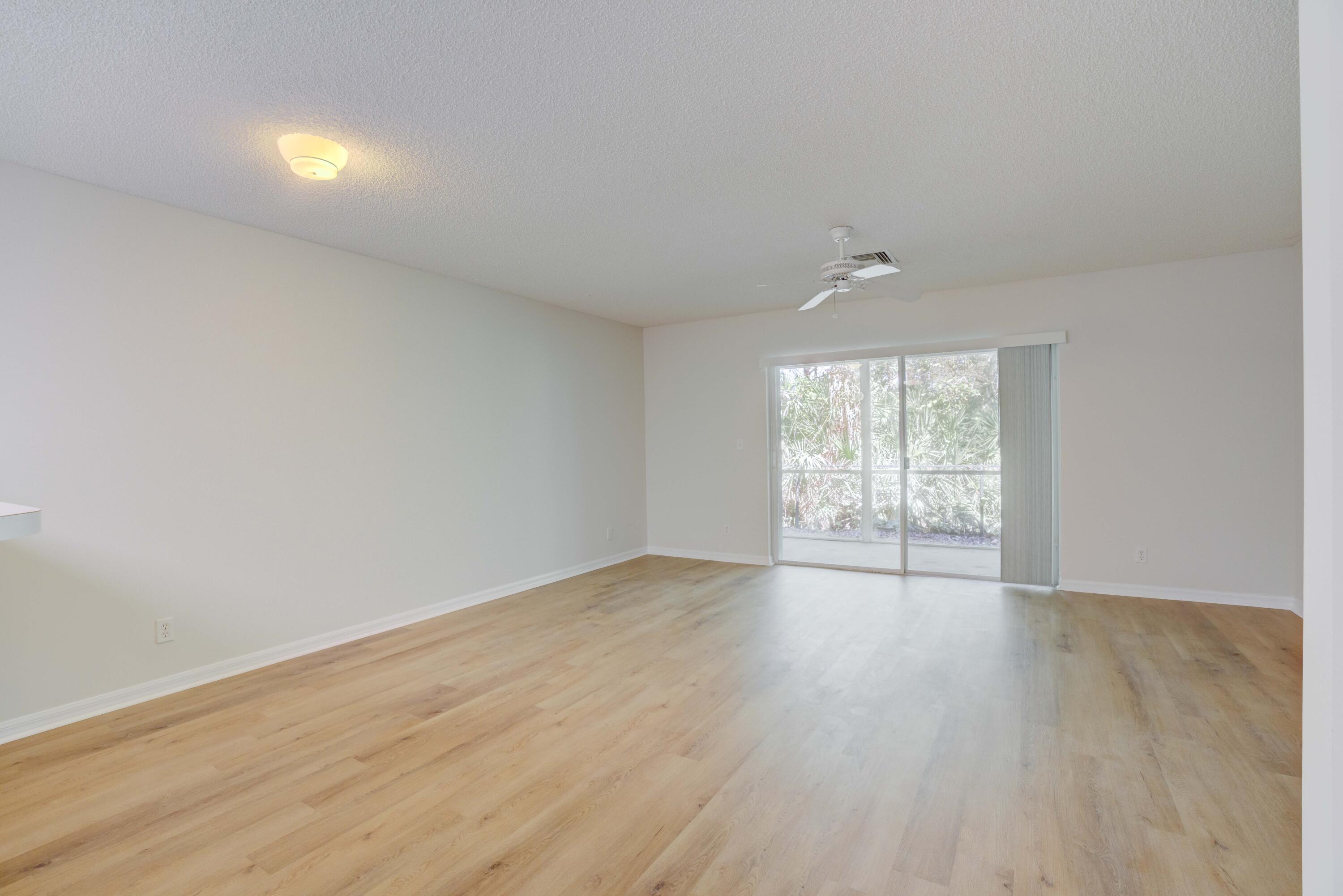 159 Fox Meadow Run Jupiter, FL 33458 - Photo 19 of 37 Dining and Living Area