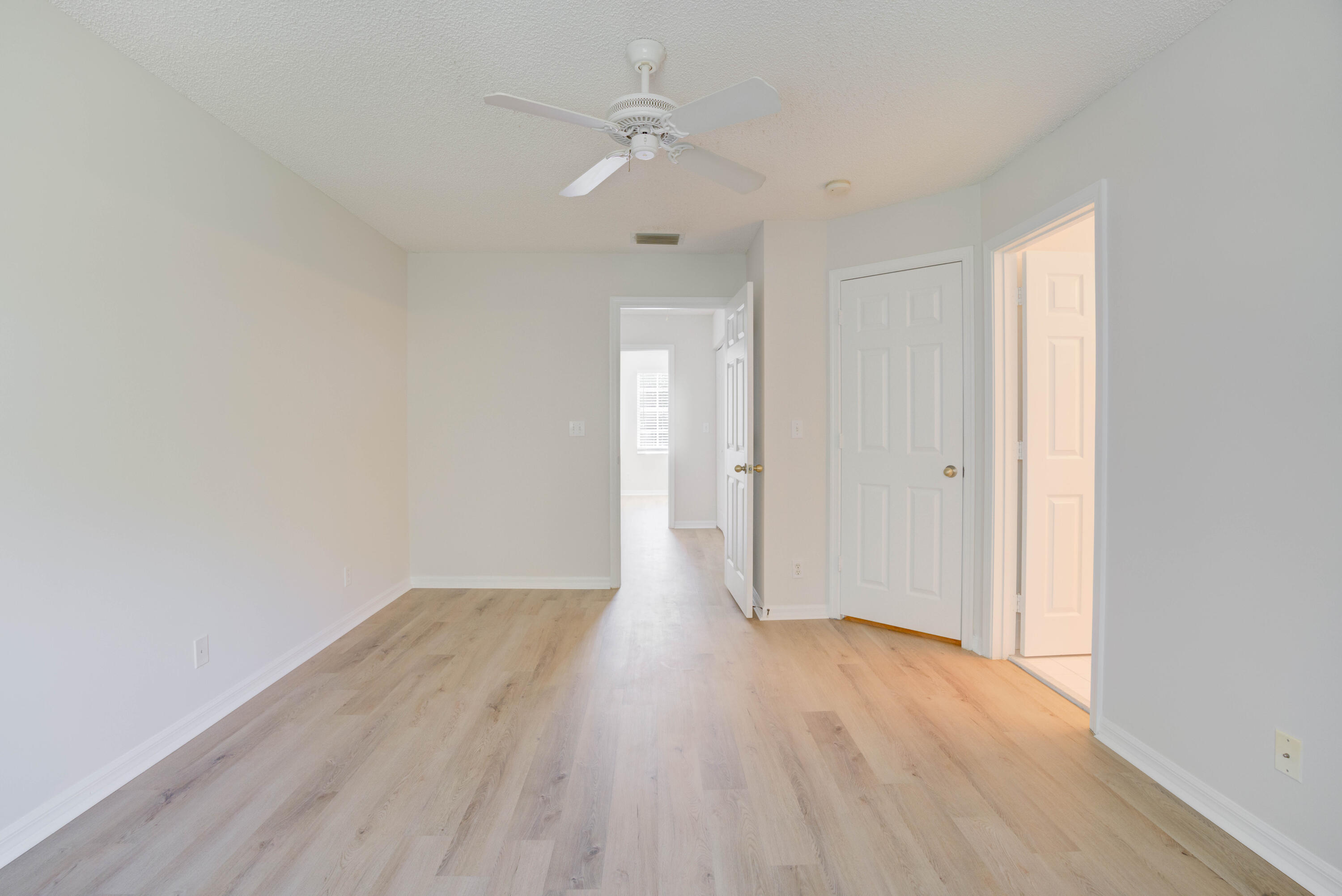 159 Fox Meadow Run Jupiter, FL 33458 - Photo 28 of 37 Bedroom 1 View to Hallway