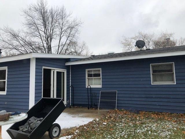 29 Surrey Road Montgomery, IL 60538 - Photo 24 of 26 a front view of a house with a garden