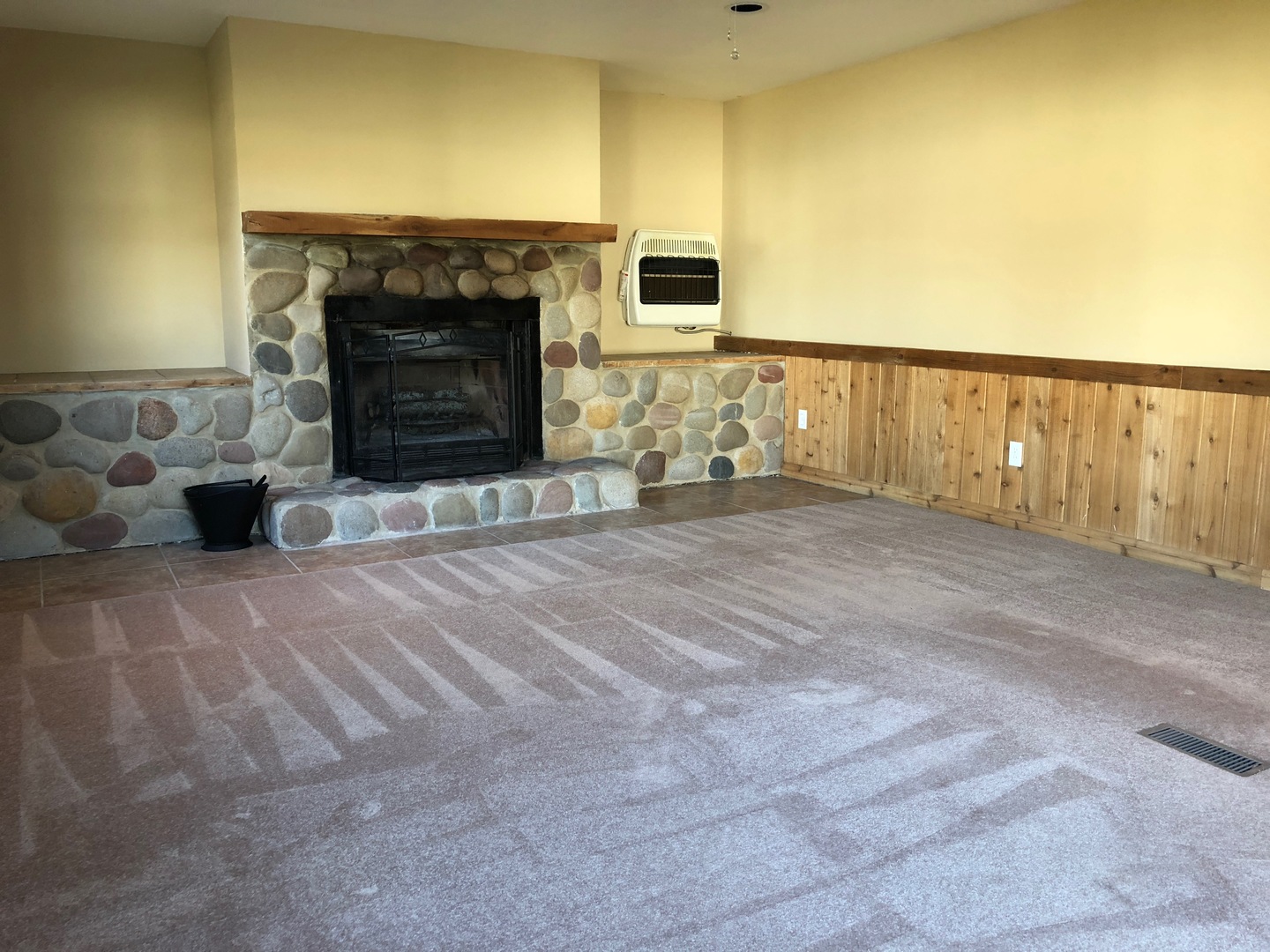 29 Surrey Road Montgomery, IL 60538 - Photo 6 of 26 a view of an empty room with a fireplace