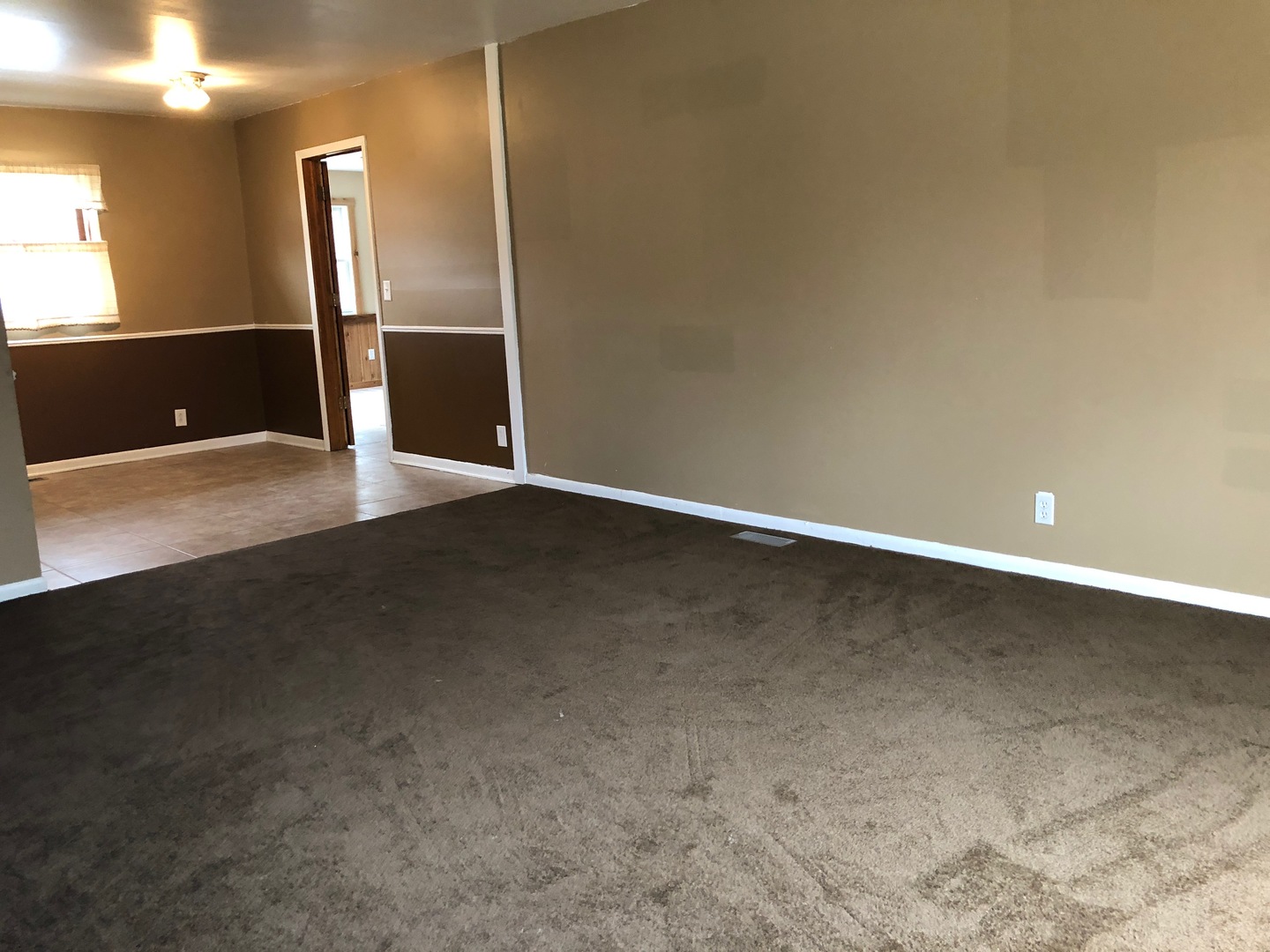 29 Surrey Road Montgomery, IL 60538 - Photo 7 of 26 a view of an empty room with wooden floor