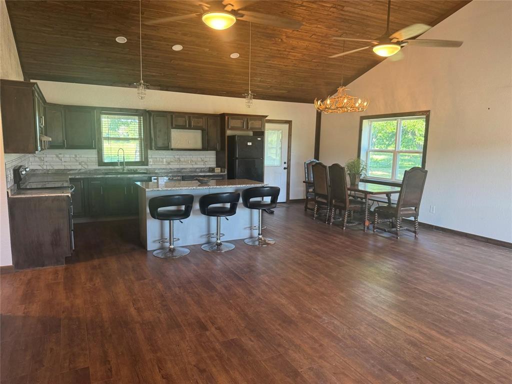 377 Private Road 3249, Unit ARENA Decatur, TX 76234 - Photo 26 of 40 a view of a dining room with furniture window and wooden floor
